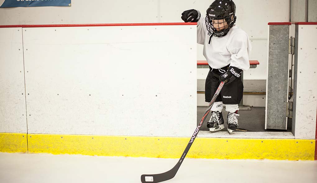Child playing hockey