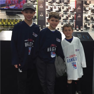 Three Children Posing With At New York Rangers Learn To Play Event