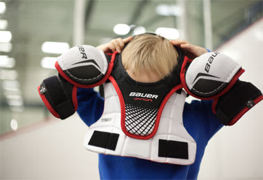 trying on hockey equipment