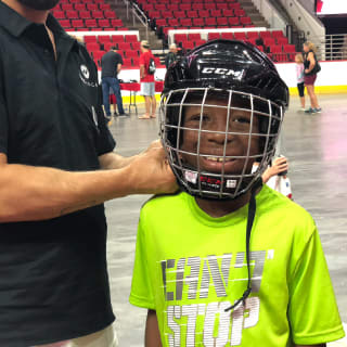 Pure Hockey Associate Fitting Young Child For Hockey Helmet