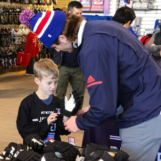 Pure Hockey Associate Fitting Young Child For Hockey Gloves